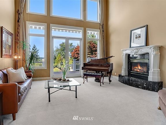 Formal living leads directly to deck with steps leading to courtyard below.