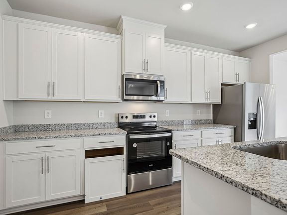 Kitchen in the Crestview floorplan in Meritage Homes community.