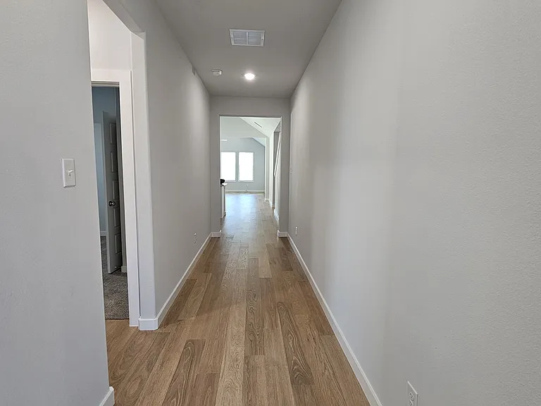 Step into a bright, airy foyer that create an immediate sense of space.