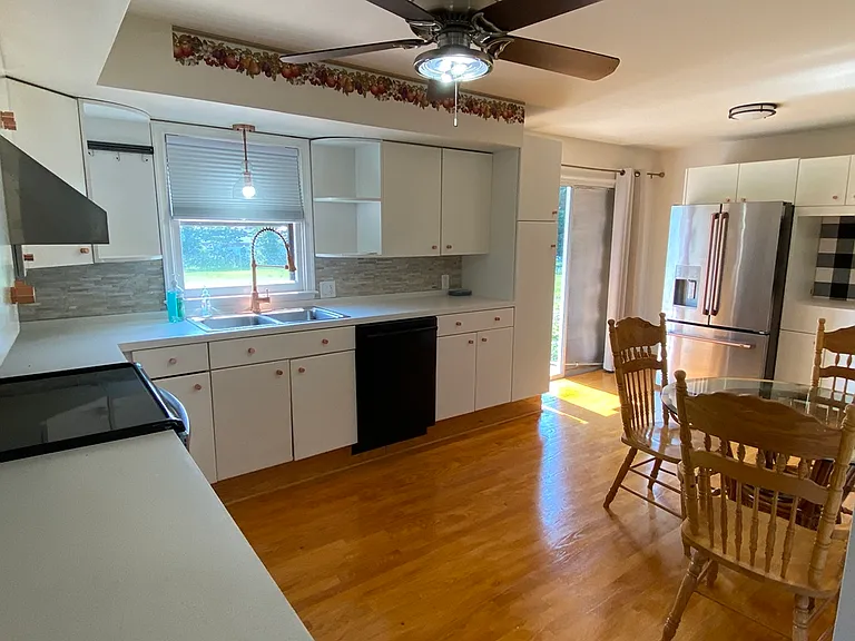 View of Kitchen w/ Hardwood Floors & Clg Fan