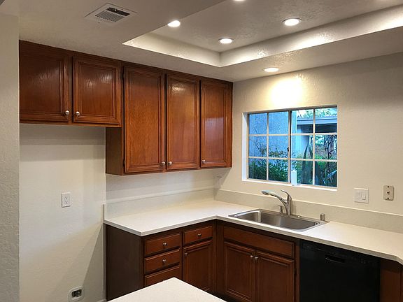 Remodeled Kitchen with Recessed Lighting and New Gas Stove
