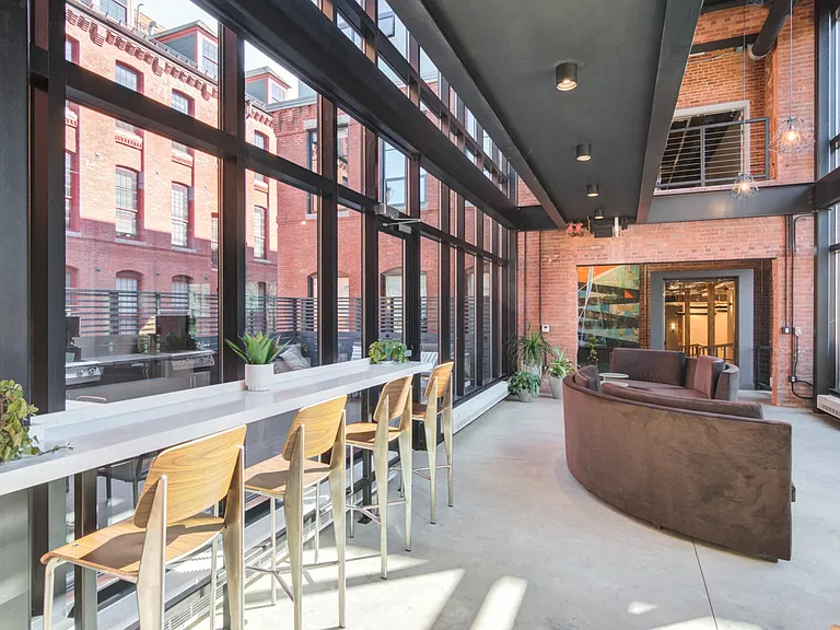 Unique and stylish glass connector with bar stool seating
