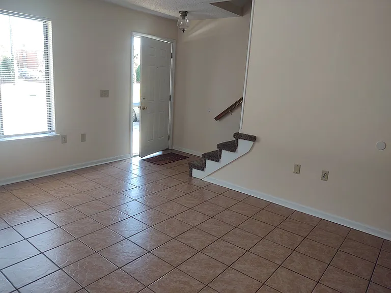 View to entrance & 2nd floor from living-room.