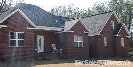 Beautiful Brick Home
						:
						Home is located within 10 acres of pines, with a 1 acre yard.