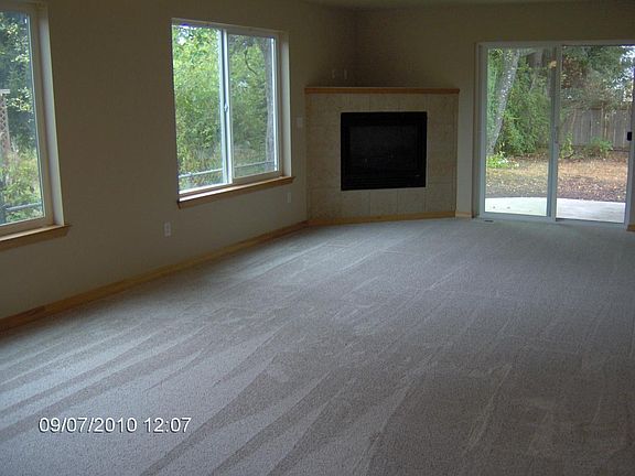Large living room with fenced private yard and patio