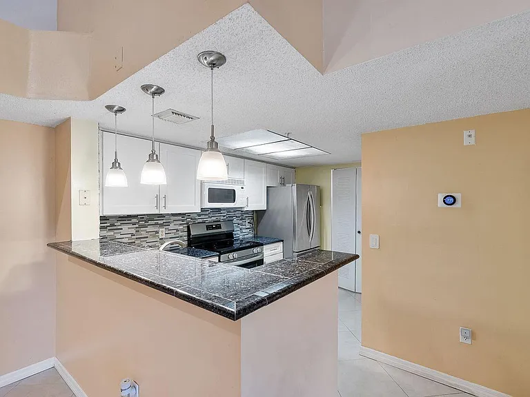 5011 Wiles Rd #303 — Photo 23