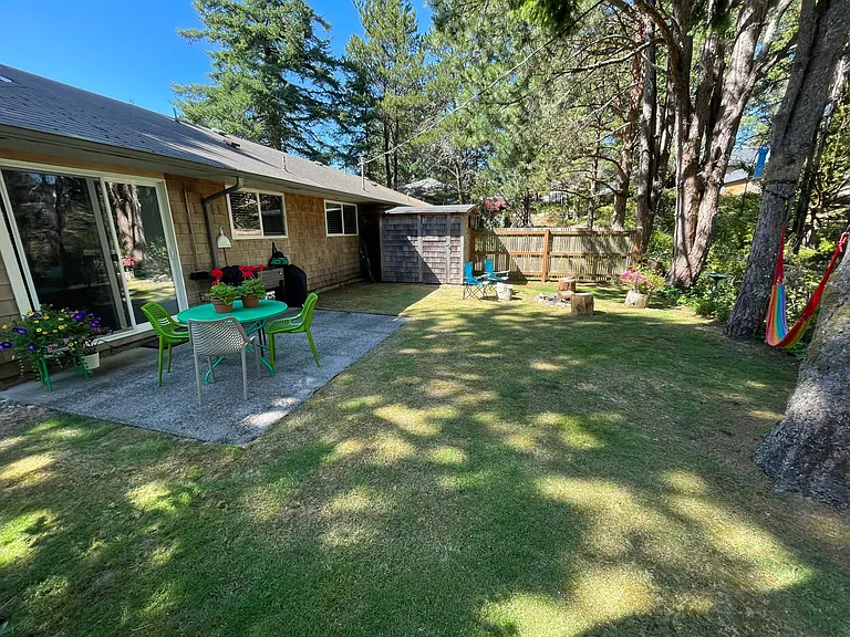 Might be the best part; private back yard, patio area, Weber charcoal and electric grills, fire pit and peaceful, verdant views.
