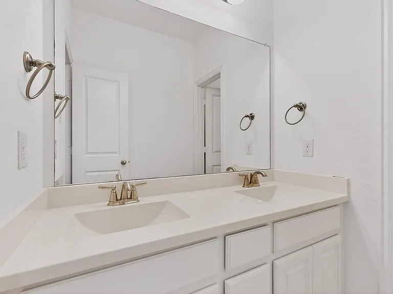 Bright bathroom with dual sinks
