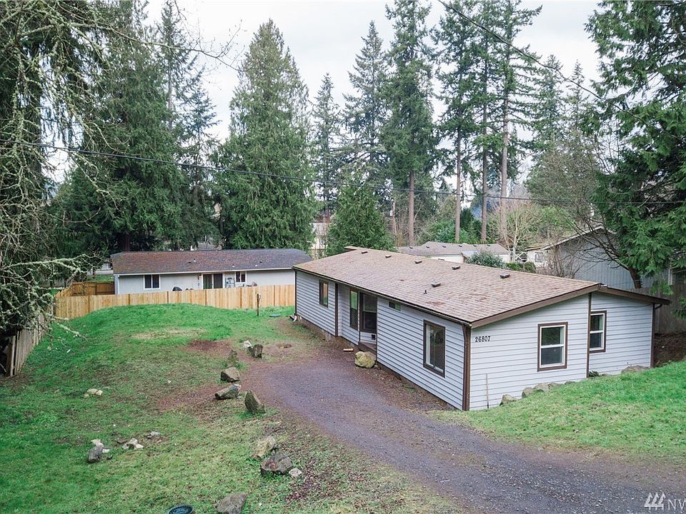 View of the home from the top of the driveway. Two of the bedrooms are at this end of the home while the master suite is at the other end of the house.