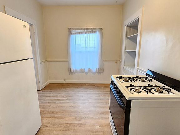 Walking into the "L" shaped kitchen