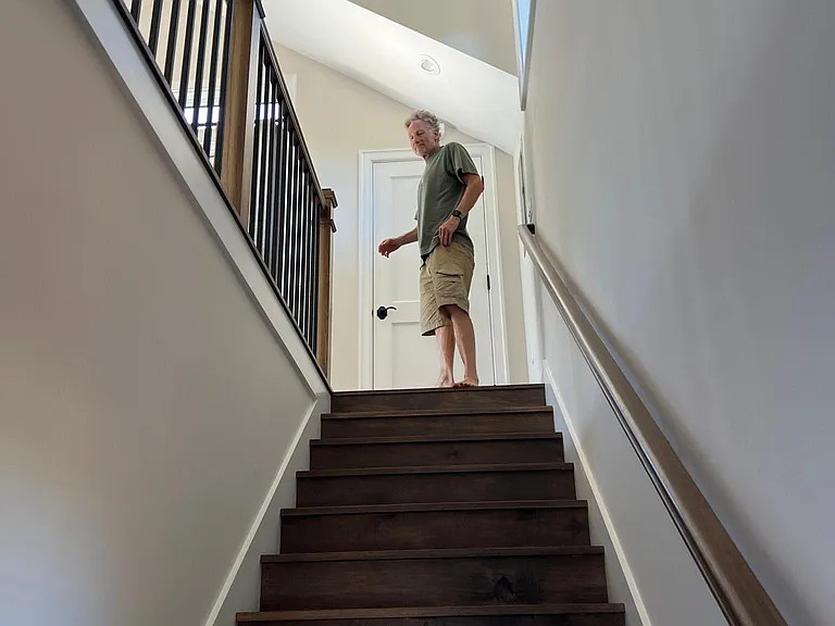 Stairs leading from front door to upstairs living space