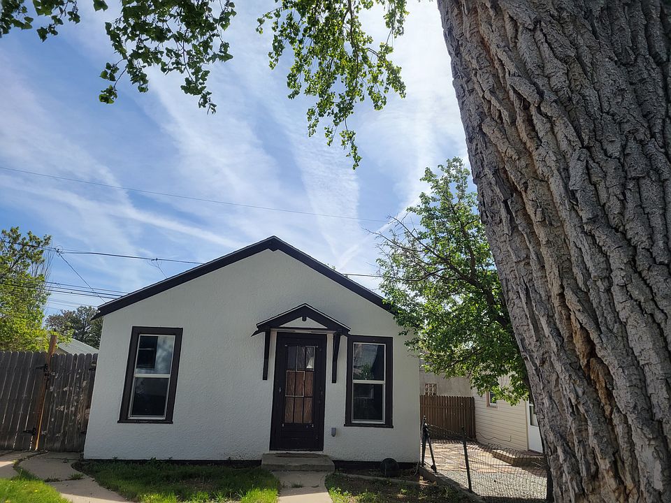 Mother-in-law cottage shares fenced yard and mature trees