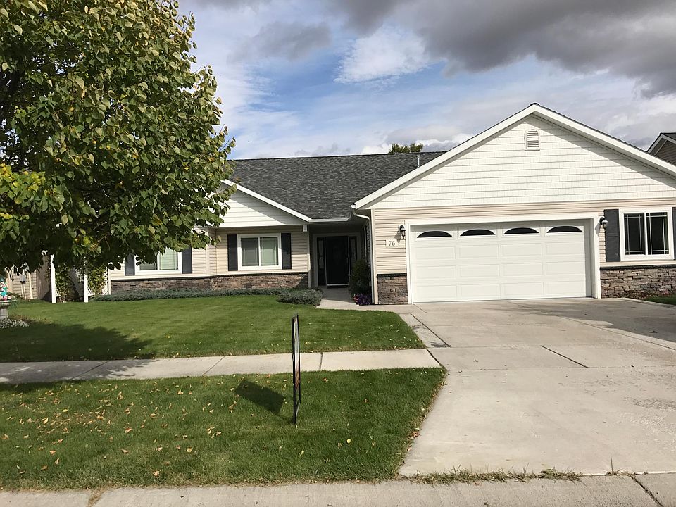 Front view with large two car garage - note large storage area on far side.