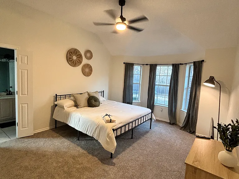 primary bedroom. There is a larger desk with big screen T.V and reading nook.