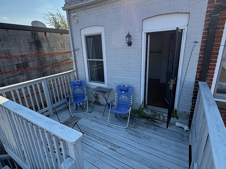 Large deck area on second floor and private entrance to rear bedroom. Great for hanging out or entertaining.
