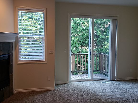 living room, slider to deck overlooking forest