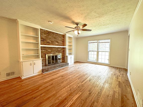Large built in bookcases and fireplace