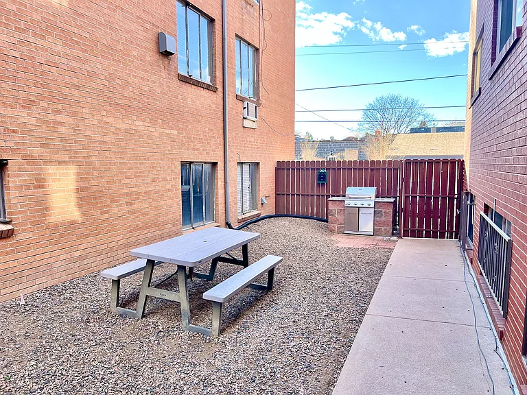 Relax in this charming outdoor patio space, perfect for gatherings and barbecues.