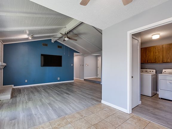 Laundry room adjacent to the living room and includes Washer & Dryer.