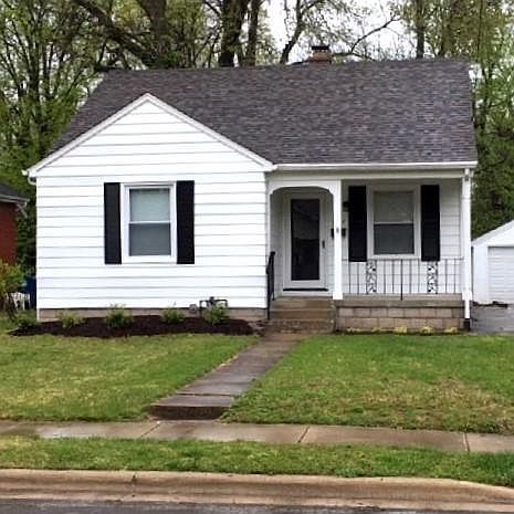 Exterior with new landscaping and painted exterior