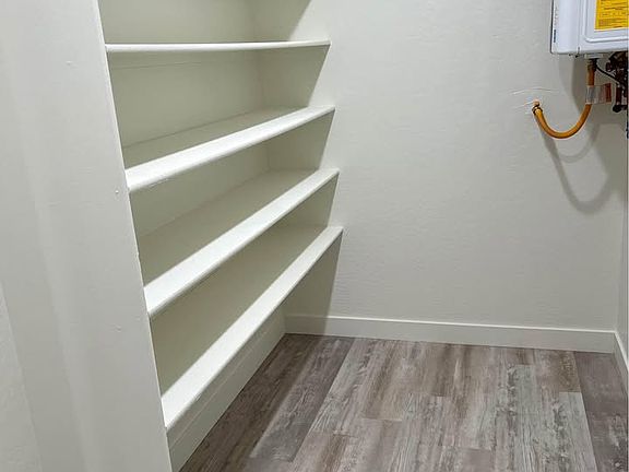 Laundry room storage, instant water heater