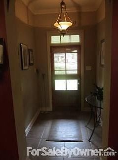 Front Elevation
						:
						Large front yard with relaxing swing.