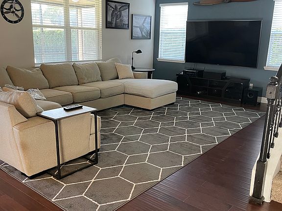 Family Room with large sectional, 85" tv and full dolby surround sound