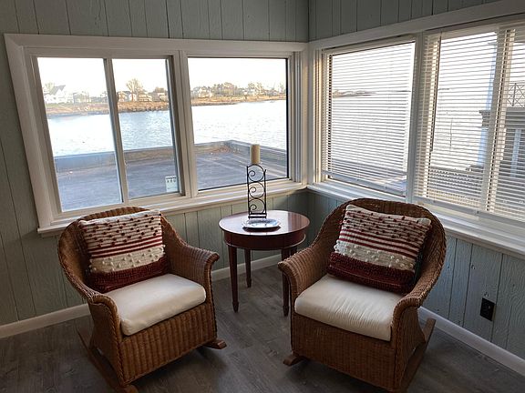 Lovely ocean views from living area. Sun rises over the water outside the window.
