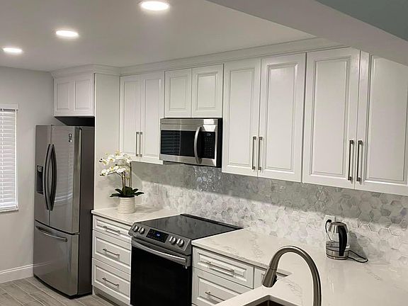 A fully equipped kitchen with modern appliances, ready for your culinary adventures