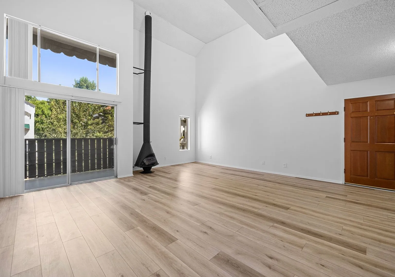 Top-Floor 1-Bedroom Condo with Vaulted Ceilings and Private Balcony — Photo 1