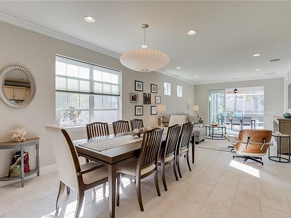 Dining area with seating for eight. Leather chair not included.