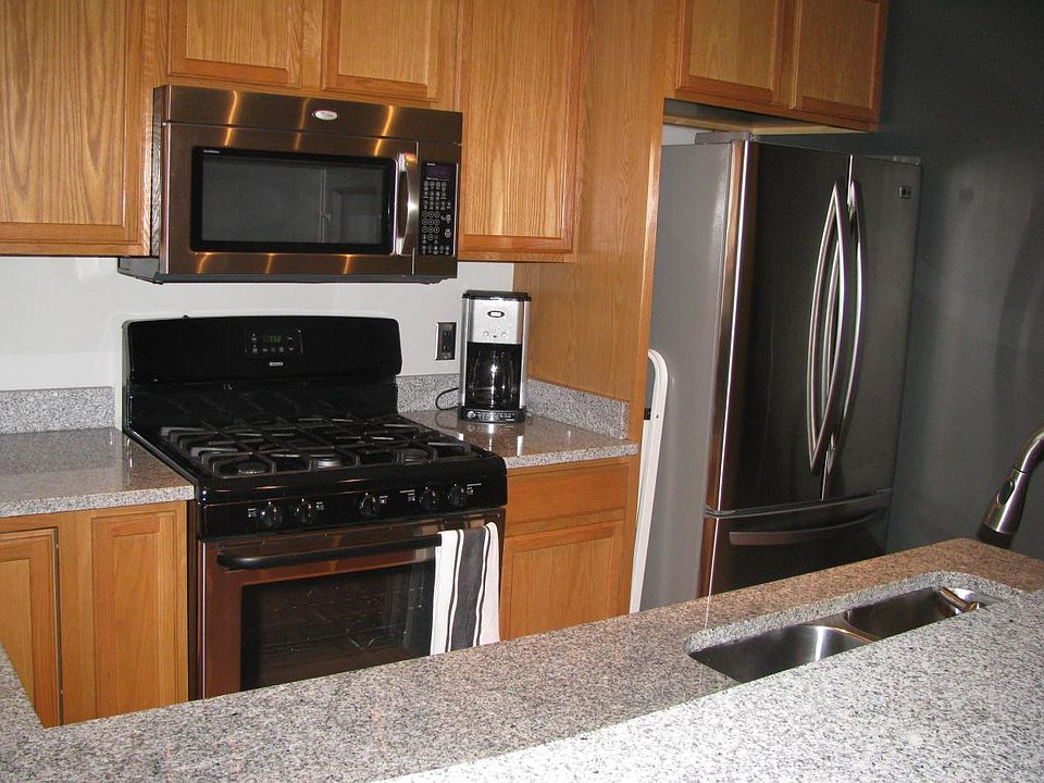 kitchen with granite counters, gas cooktop, good cupboard space and closet.