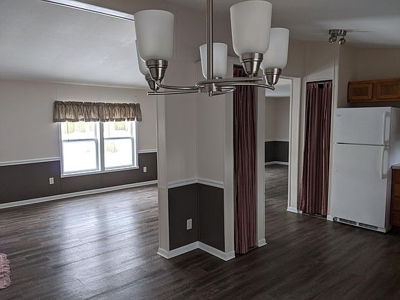 From Dining area looking into Living Rm on left and Bonus Rm on right