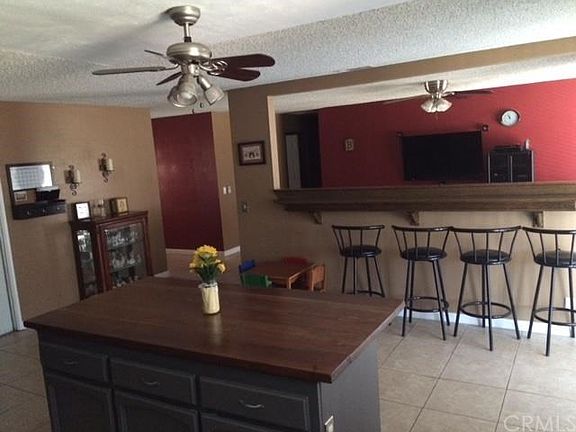 Open kitchen with bar seating and view to living room.