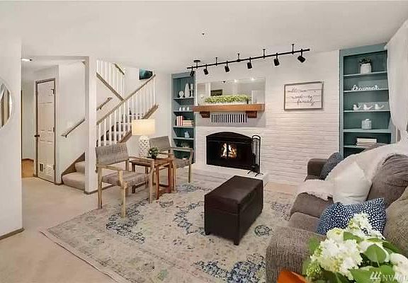 Living room with stairs to second level.