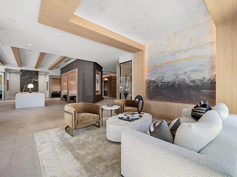 Lobby lounge with artwork, plush seating, and modern design
