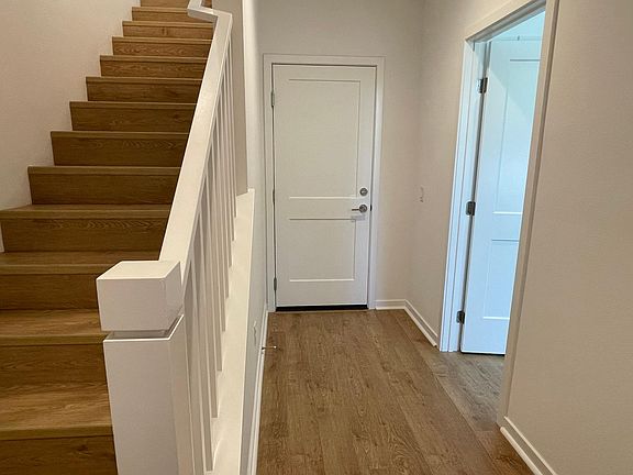 Downstairs Entry, Stairs, Garage Access and Bedroom