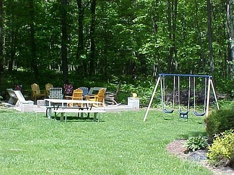 FIRE PIT AND WOODED BACKDROP