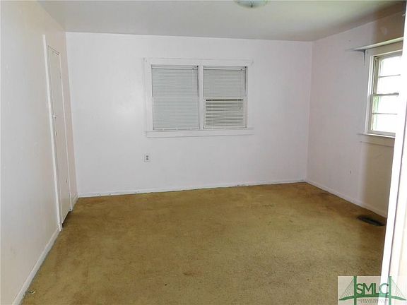 Bedroom 1 adjoins the bath