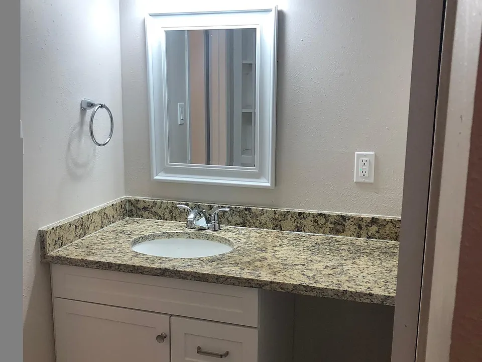 vanity between bathroom and closet
