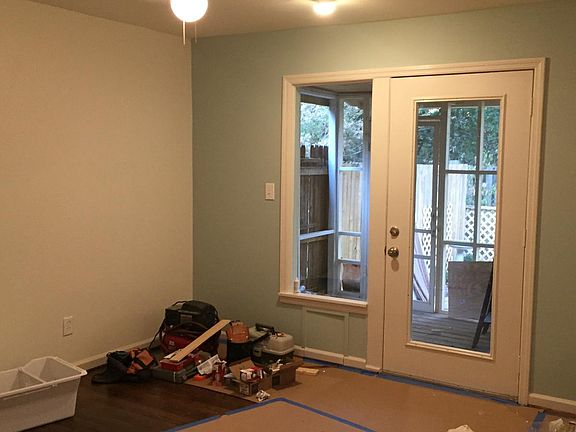 Den or Dining Room leads to screened porch and garden