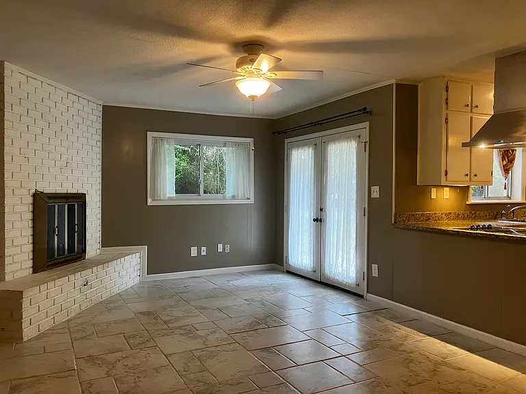 Den/Dining area with wood burning fireplace