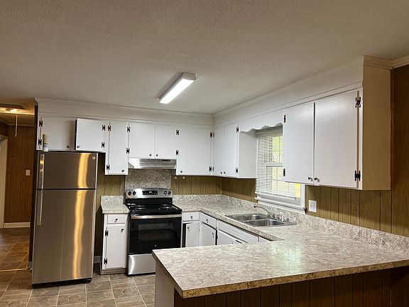 Kitchen with NEW stainless steel stove and refrigerator !!!!