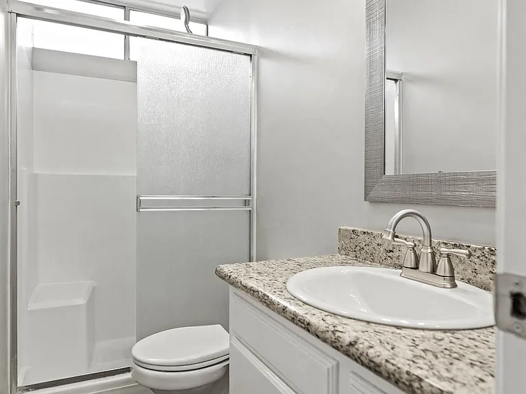 Bathroom with Walk-In Shower and Vanity Cabinet Storage