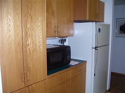 Nice wood cabinetry in kitchen with lots of storage.