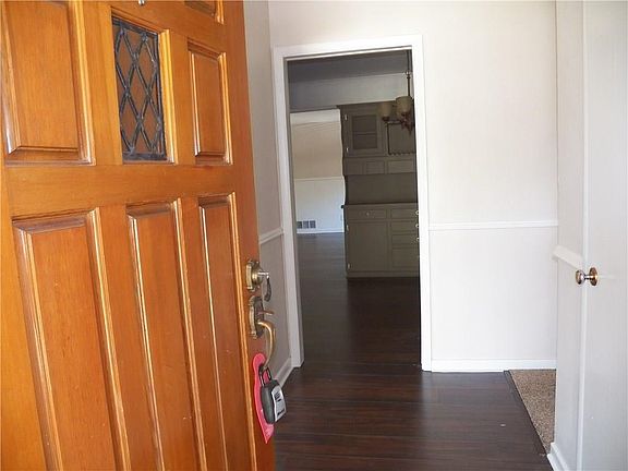 Formal living rm to the left, hallway to beds & baths to the right, dining straight ahead, with a pocket door to shut kitchen, dining, family room off from rest of the house.