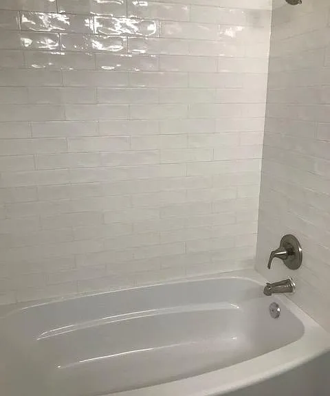 Hallway bathroom has new subway tile tub/shower