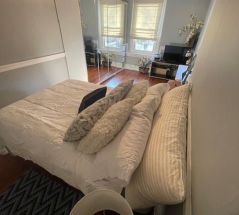 Wall wardrobe makes room look larger.