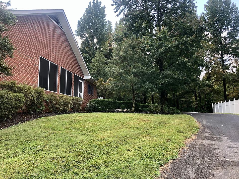 Separate driveway, leading to single car garage. Screened porch leads to private entrance to unit.