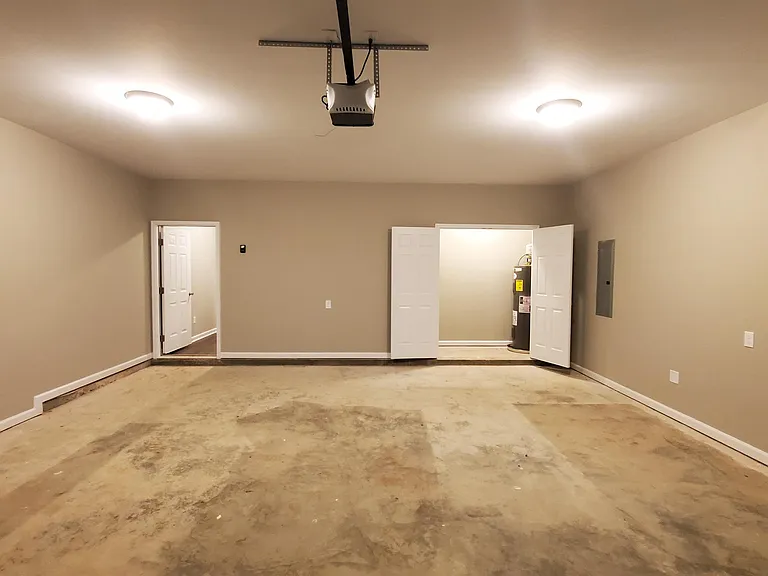 Garage includes added storage in water heater closet